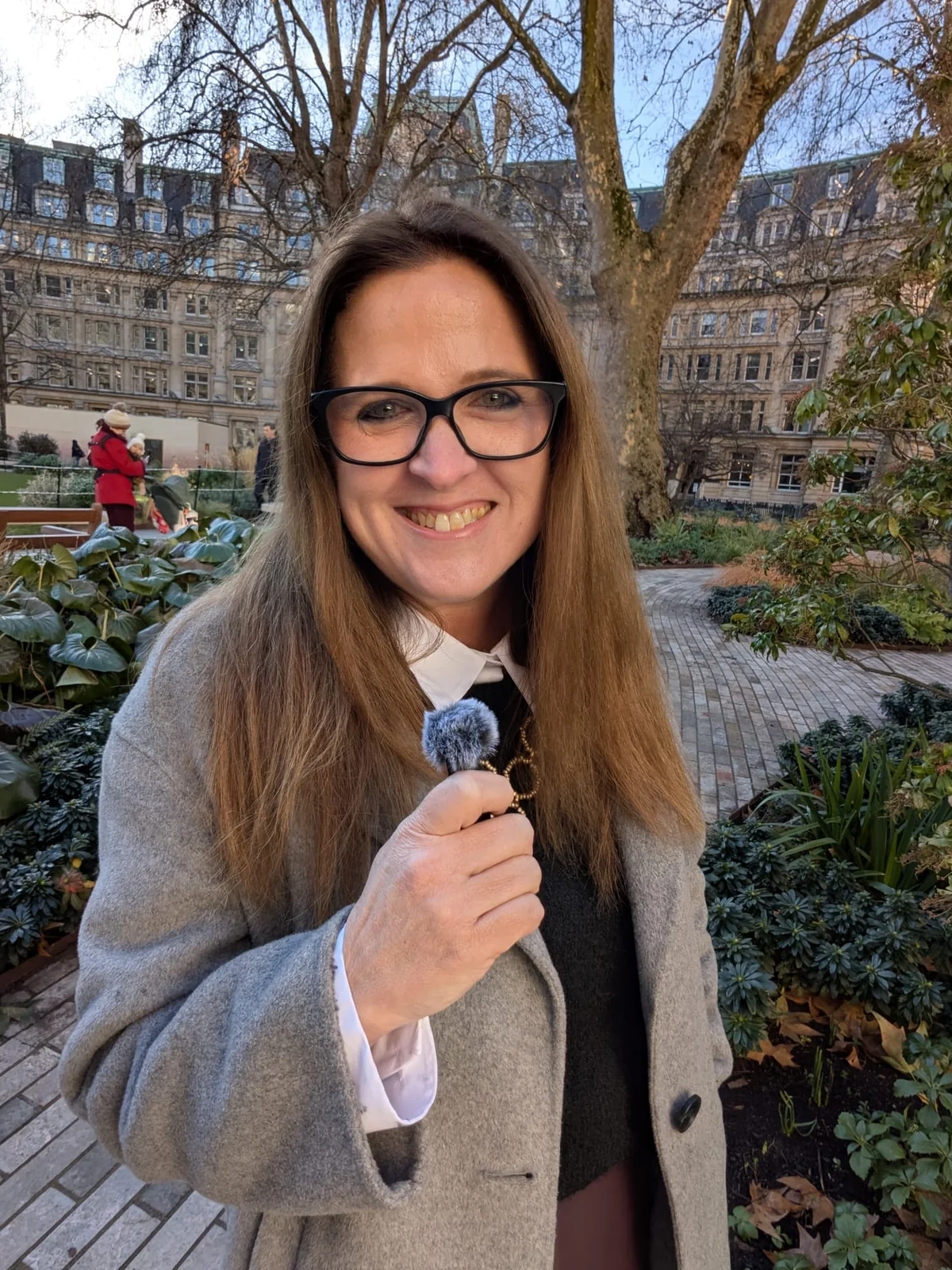 Jess speaking outdoors at an event