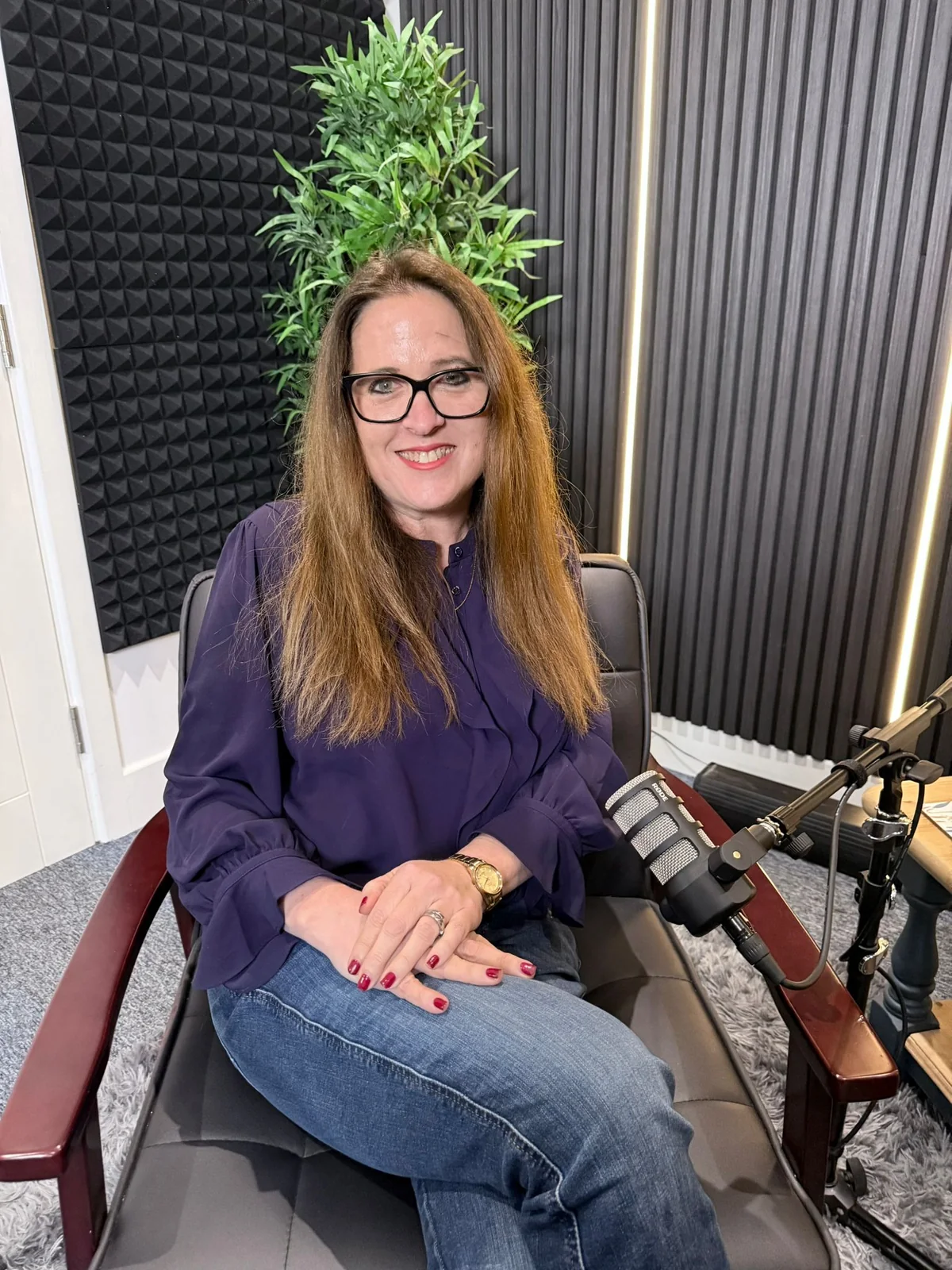 Jess Pressland in a podcast studio