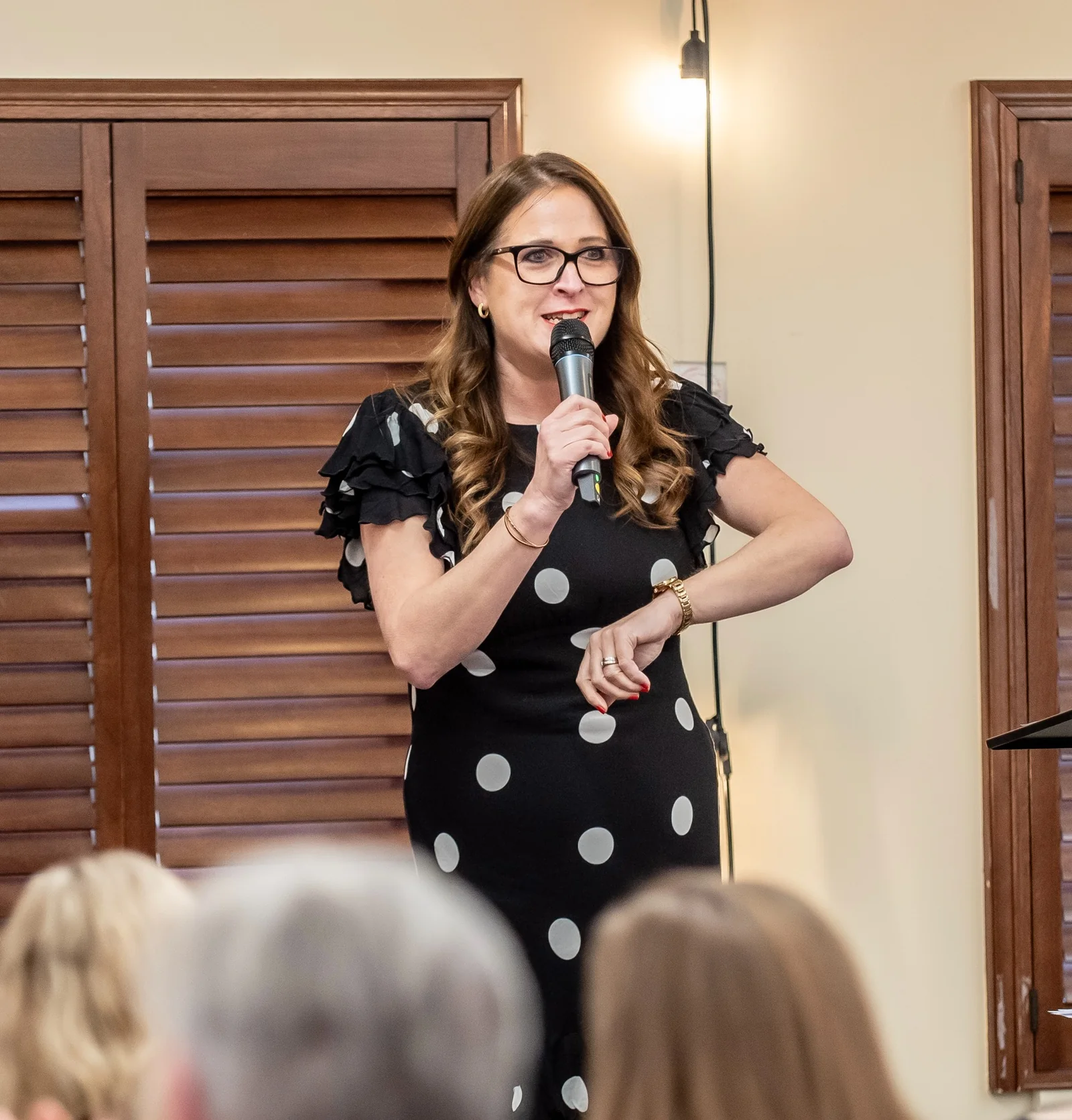 Jess speaking at a live event